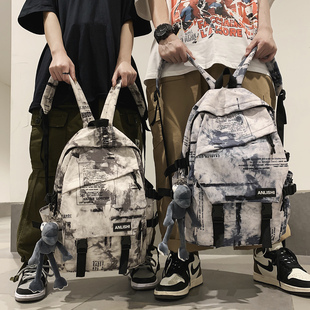 双肩包男2025新款大容量旅行包女生初中生高中大学生书包扎染背包