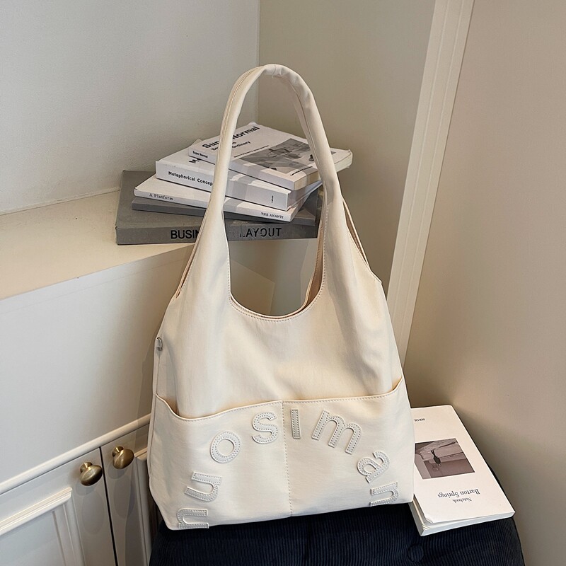 原创设计大容量单肩包多口袋简约托特包上班通勤帆布包包2026新款