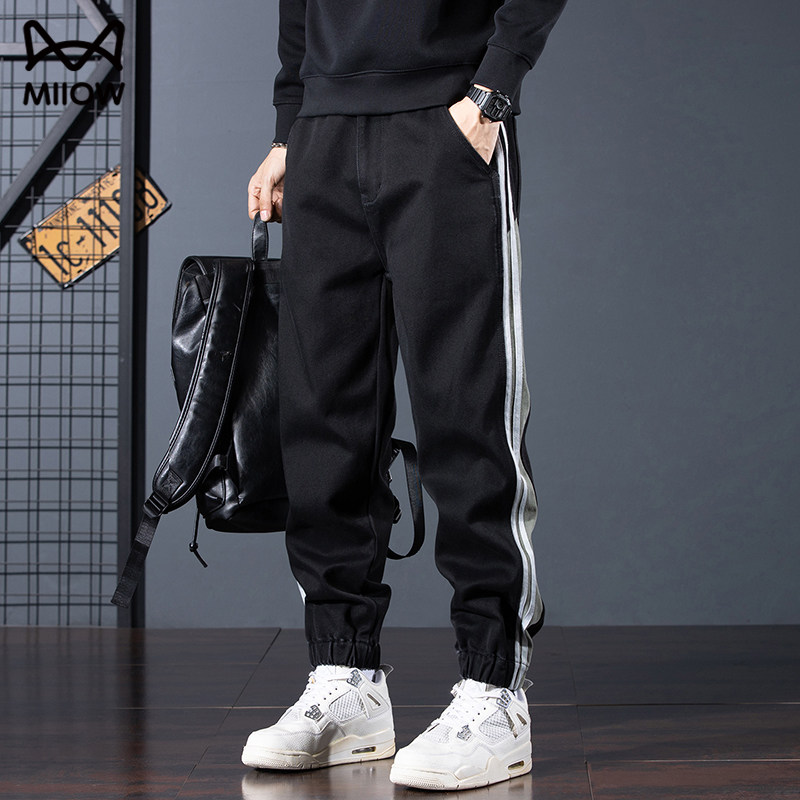 猫人秋冬黑条纹拼接束脚牛仔裤