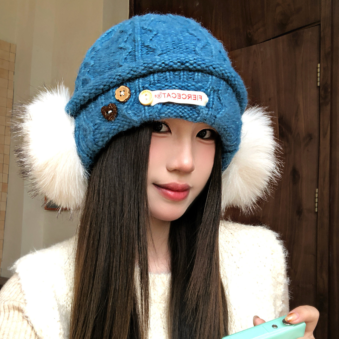 蓝色纽扣毛球耳罩针织帽子女秋冬保暖显脸小包头帽韩系护耳毛线帽