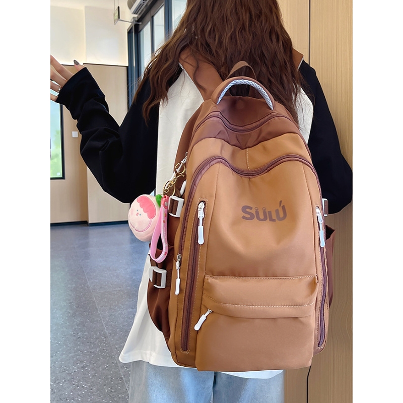 法国正品MK DN~大学生双肩包女高中小学生初中生书包女减负背包男