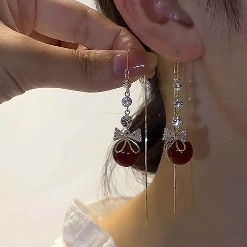 珍珠蝴蝶结流苏长款耳线