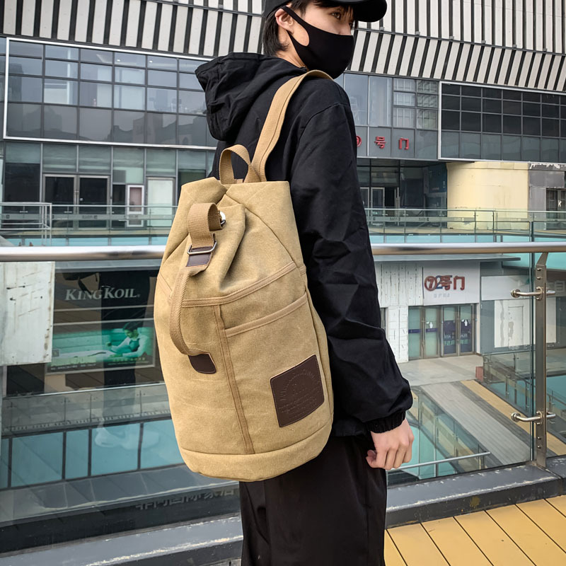 男士双肩包男式背包运动包包男款旅行帆布男包休闲户外双肩水桶包