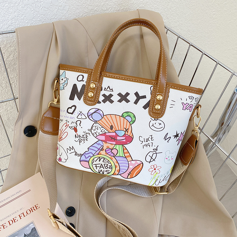 卡通涂鸦水桶包蜜萝猫百搭小包