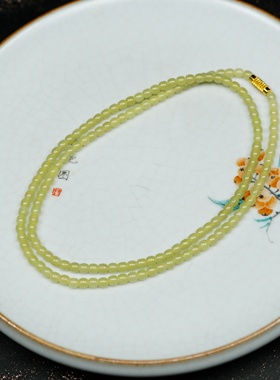 晓风初染嫩鹅黄。新疆若羌黄口料和田玉5乘4直切多圈手项链