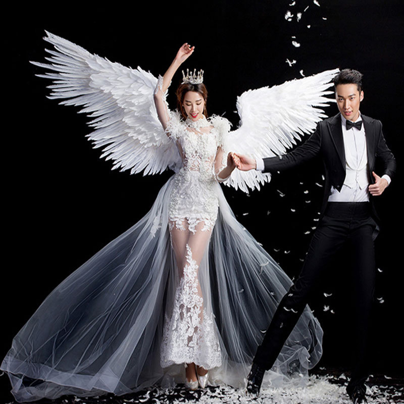 影楼婚纱摄影旅拍照收腰鱼尾礼服白纱羽毛翅膀主题工作室写真服装