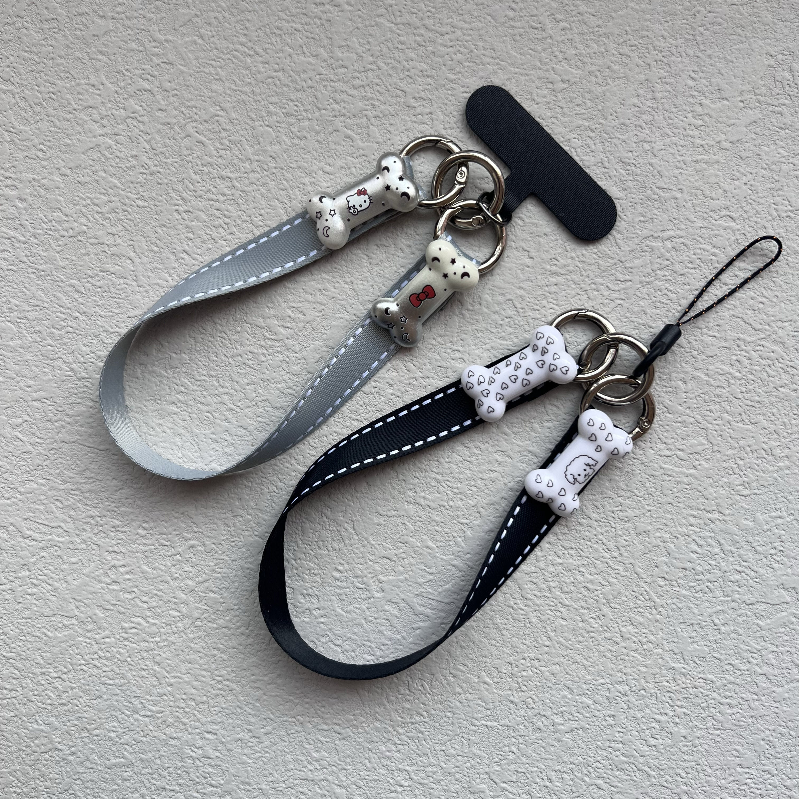 新款个性创意爱心小狗猫咪可爱小骨头手机壳三钩双面垫片款手腕绳