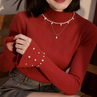 2025冬季红色高领珍珠装饰长袖针织衫女气质优雅百搭打底毛衣