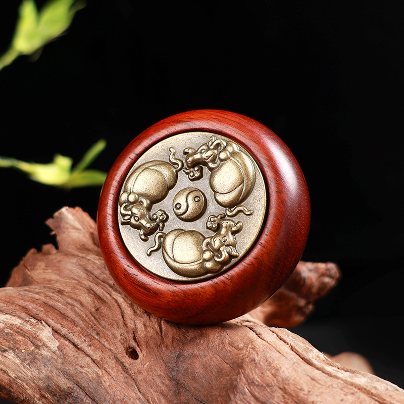 承善堂复古紫檀双面赚钱手把件