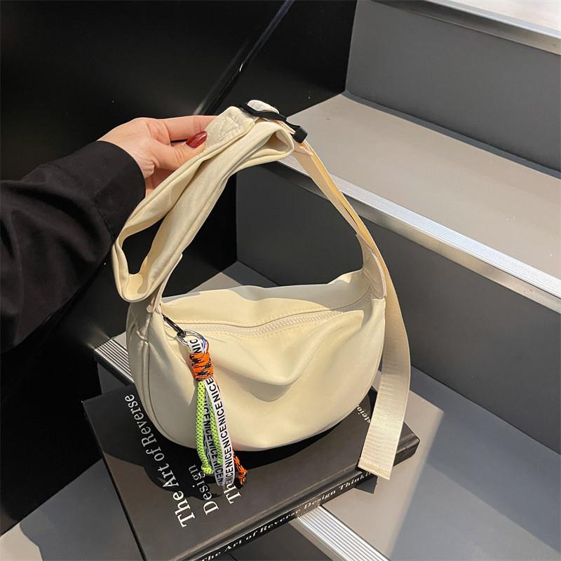 新款帆布休闲饺子包女时尚春夏韩版时尚潮流单肩高级感简约斜挎包