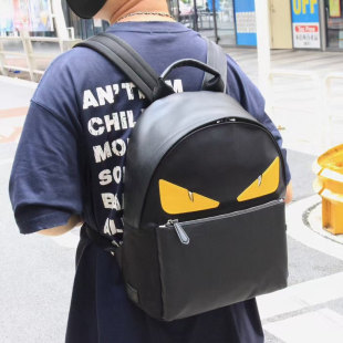 韩版尼龙布配布背包小怪兽双肩包青年黄眼睛书包休闲恶魔潮旅行包