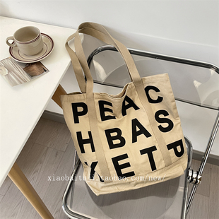 小白兔几 卡其色字母印花帆布包ins慵懒风单肩布袋女大容量托特包