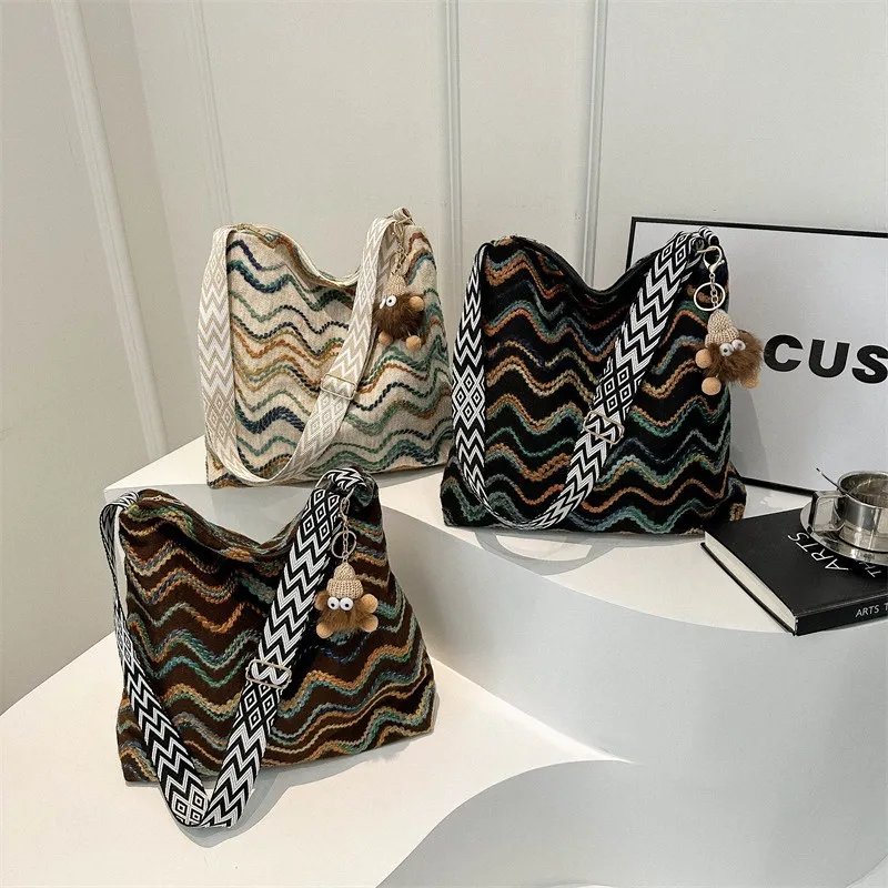 毛呢质感包包女2024春季新款民族风格纹条纹水桶包撞色彩色斜挎包,运动包/户外包/配件,单肩包,淘宝优惠券,粉丝福利购,淘宝优惠卷