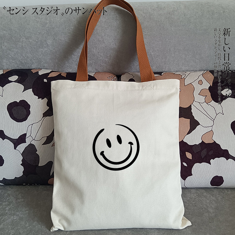 日系潮流高品质笑脸可爱帆布包