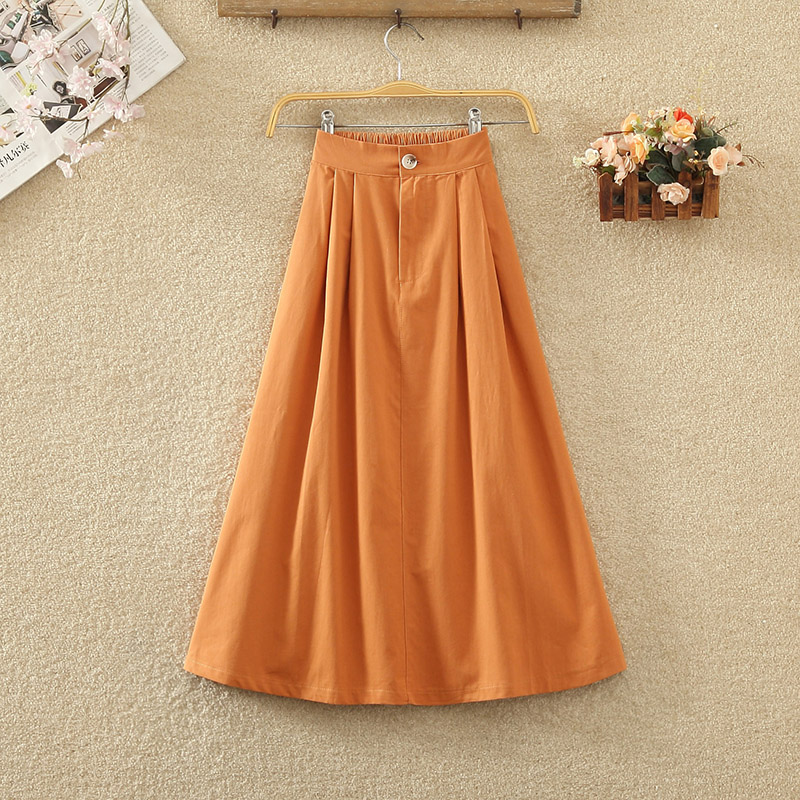 文艺港味纽扣a字口袋大摆半身裙