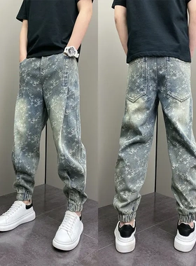 潮流男士春秋新款牛仔裤浅蓝色重工提花束脚裤早秋松紧腰小脚裤