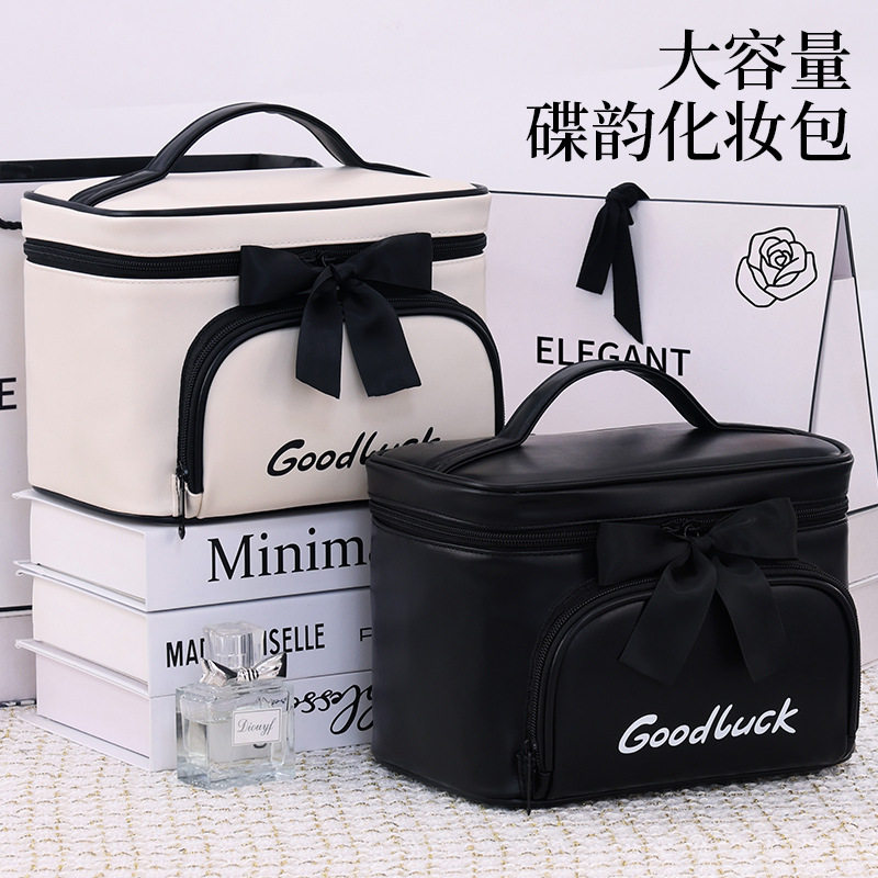 简约高级蝴蝶结大容量防水化妆包
