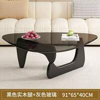 A modern and simple Nordic transparent and minimalist glass coffee table for home use in a small-sized living room. It is a creative round tea table by Isamu Noguchi thumbnail 2