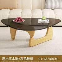 A modern and simple Nordic transparent and minimalist glass coffee table for home use in a small-sized living room. It is a creative round tea table by Isamu Noguchi thumbnail 8