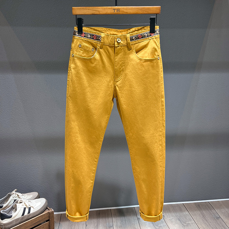高端轻奢黄色九分牛仔裤男痞帅修身小脚裤休闲百搭织带装饰长裤子