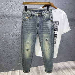 潮牌复古做旧破洞牛仔裤男秋季新款宽松小脚弹力九分锥形哈伦裤子
