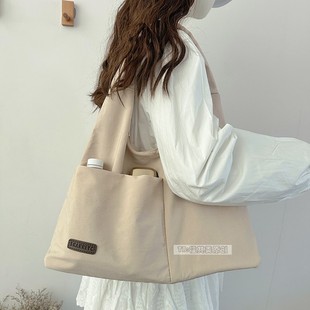 轻便大容量包包女通勤单肩托特大学生上课书包手提多兜妈咪包布袋