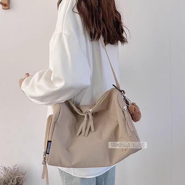 轻便尼龙布斜挎包女枕头包日系休闲通勤学生大容量单肩包男潮流