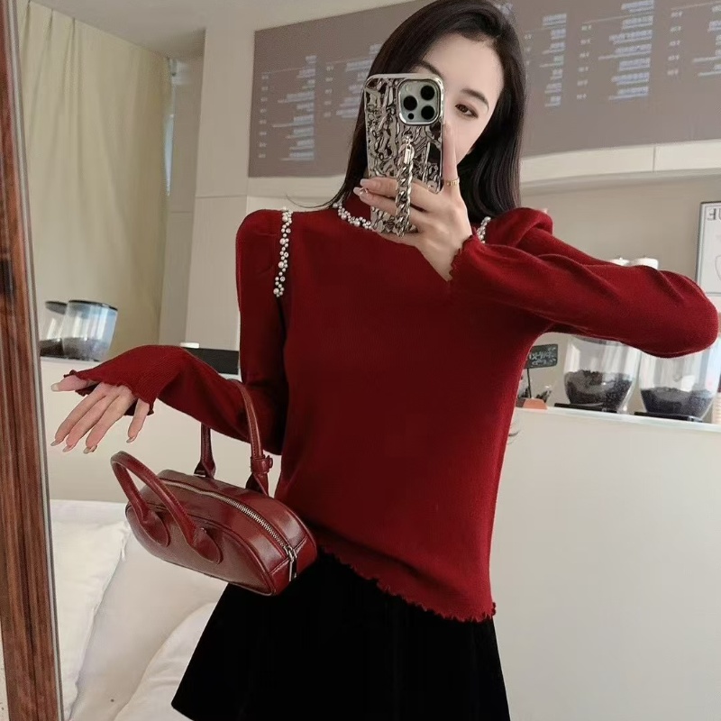 木耳边珍珠半高领设计感打底衫女2025秋冬宽松内搭上衣米白色毛衣