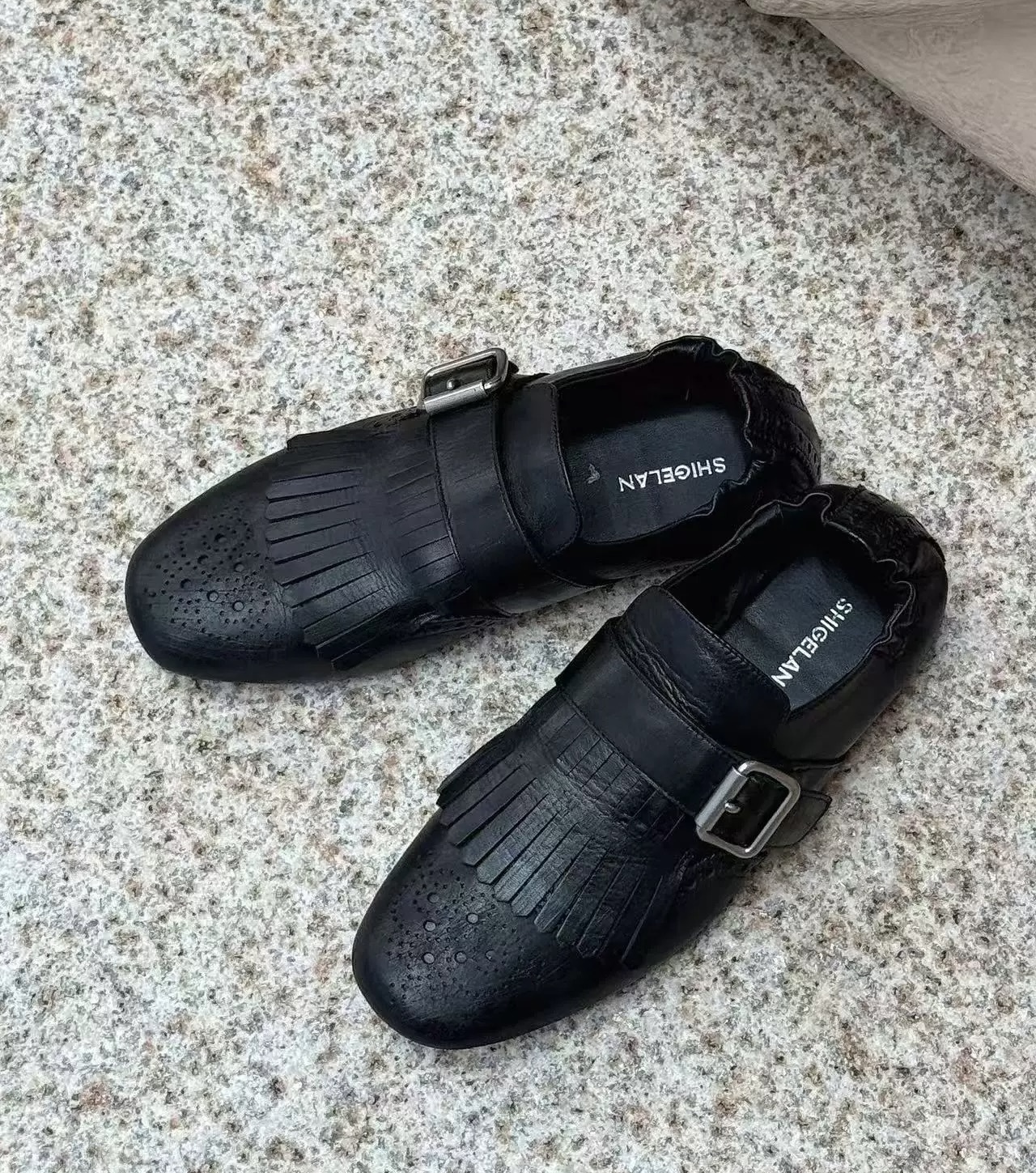 5528-9诗歌兰女鞋2025新款时尚百搭黑色真皮平底鞋流苏单鞋女皮鞋