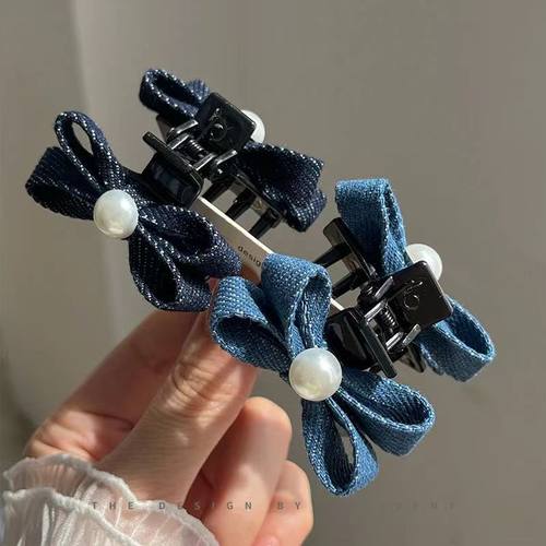 时尚牛仔色蝴蝶结小抓夹