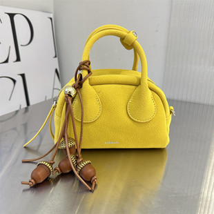 可彼娜上新小众高级感黄色保龄球包女手提斜挎包枕头包轻奢女包潮