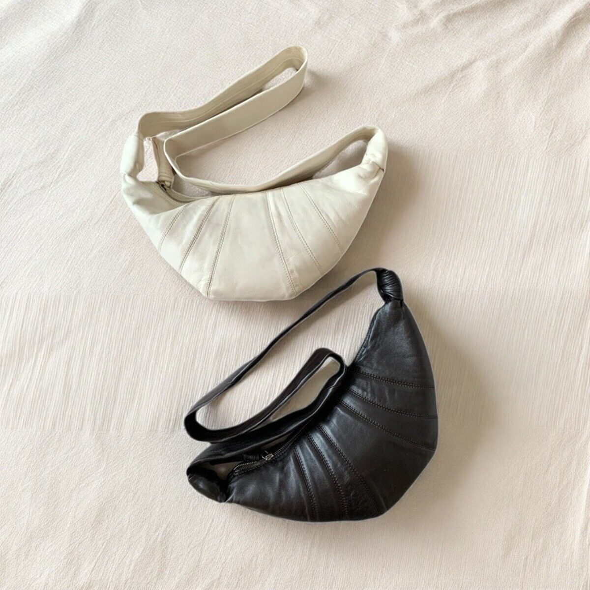 羊皮小众可颂牛角包2026新款轻奢真皮女宽带斜挎通勤饺子包月牙包