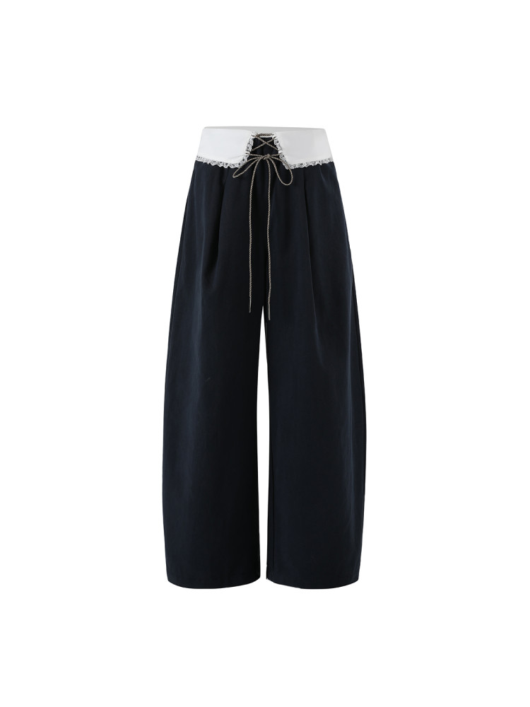 Black wide-leg pants with a white lace waistband and drawstring