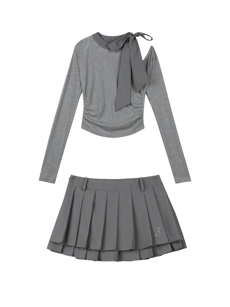 Gray long-sleeve top and pleated skirt set laid flat on a white background