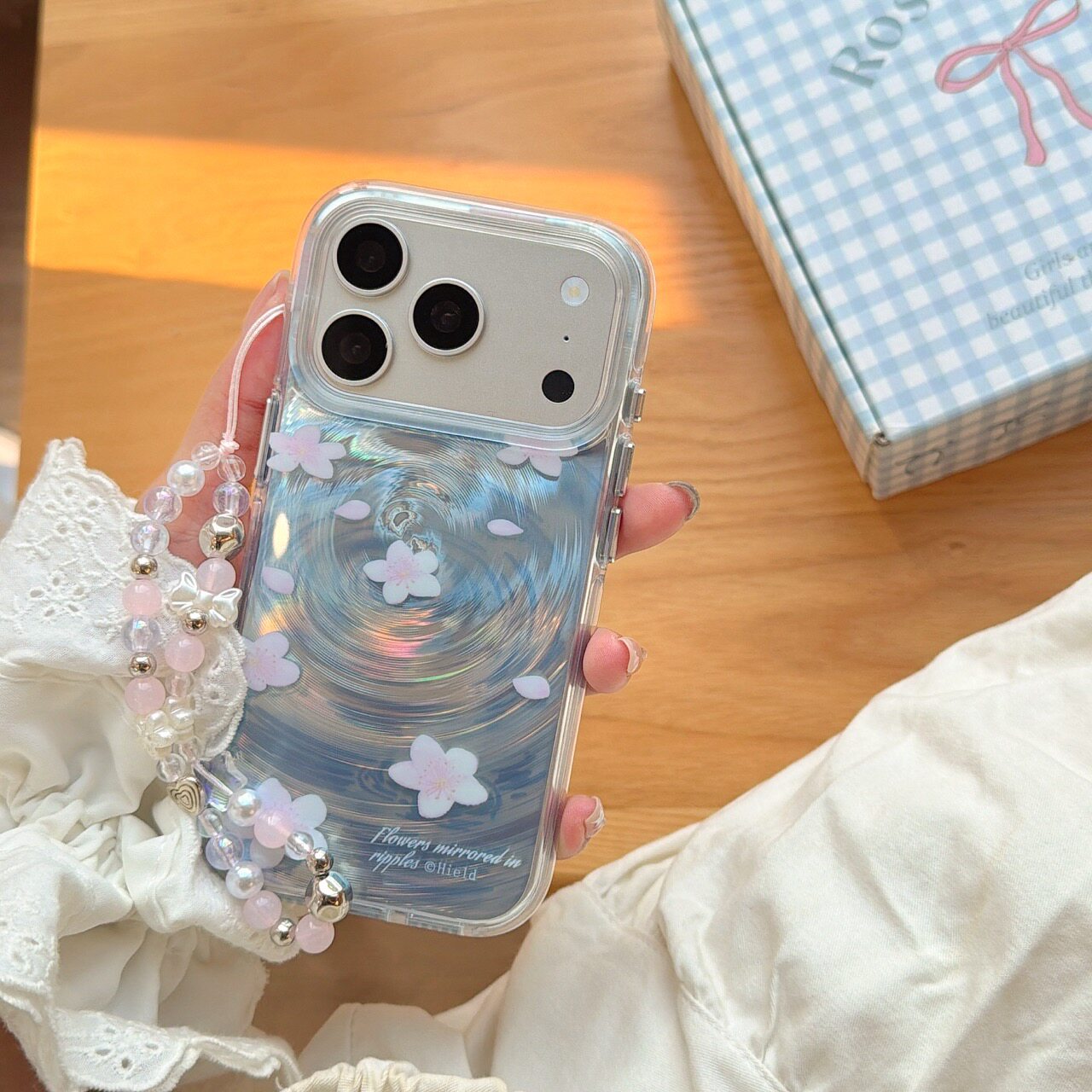 圆弧气囊IMD春日氛围粉桃花漩涡纹落花流水手机壳适用iPhone17promax大孔防摔苹果16亮面15趣味创意14手链13