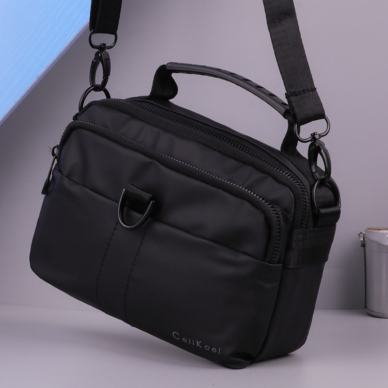 男士手提包休闲防水牛津布潮