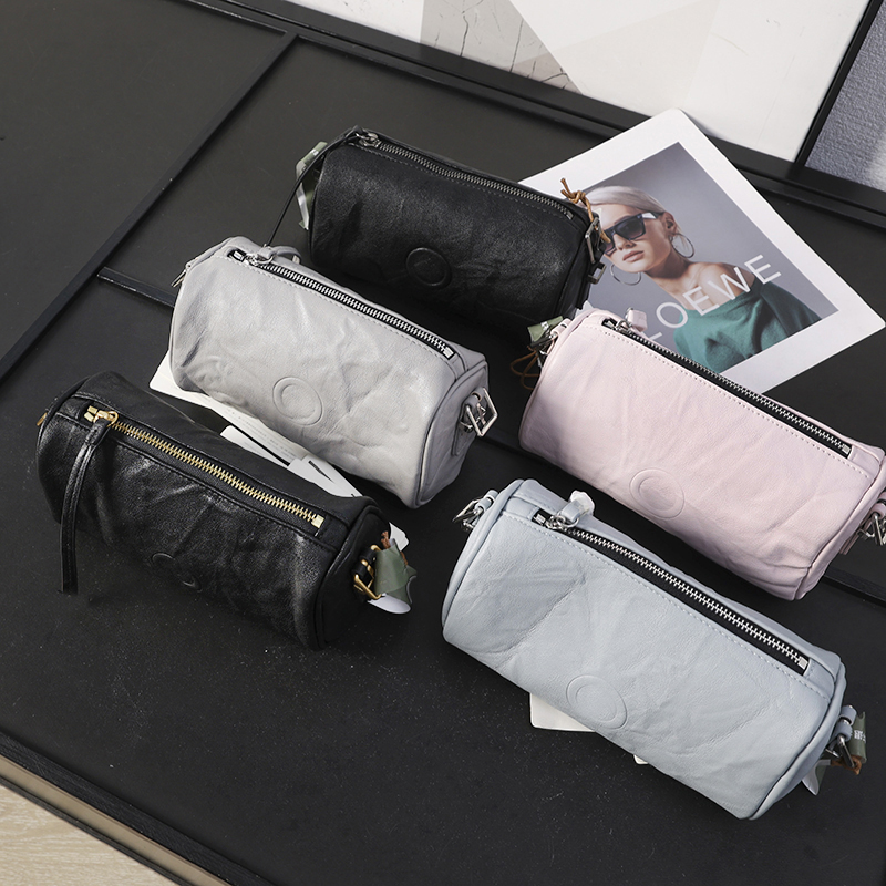 植鞣羊皮笔筒包单肩斜跨腋下包女