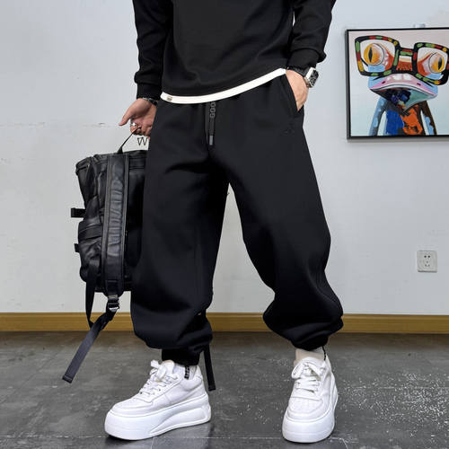 抽绳立体拼接宽松束脚加绒卫裤男
