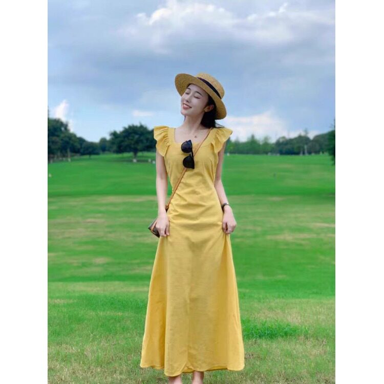 小飞袖黄色吊带连衣裙女夏高级感海边度假收腰长裙多巴胺绝美小裙