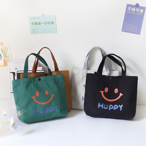 简约笑脸纯色帆布包女手拎包