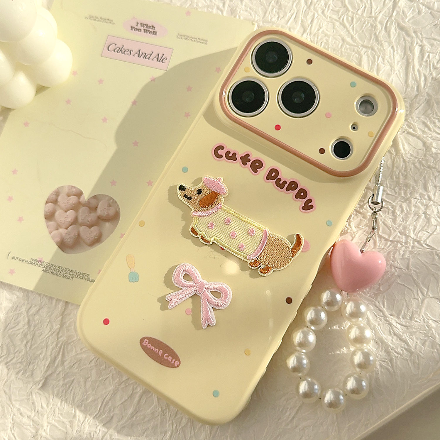 可爱蝴蝶结腊肠小狗带挂链适用苹果17promax手机壳iphone16pro新款15女款14日韩风小众13防摔12全包软保护套