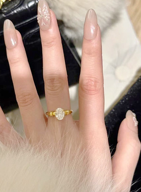 仙璨珠宝 S925银镀金色椭圆6*8mm单钻戒指女简约唯美星芒女戒指环