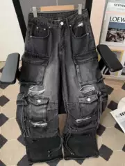 Street heavy industry multi pocket logging workwear pants for men and women with a slightly flared design, featuring holes, rough edges, and loose wide leg jeans
