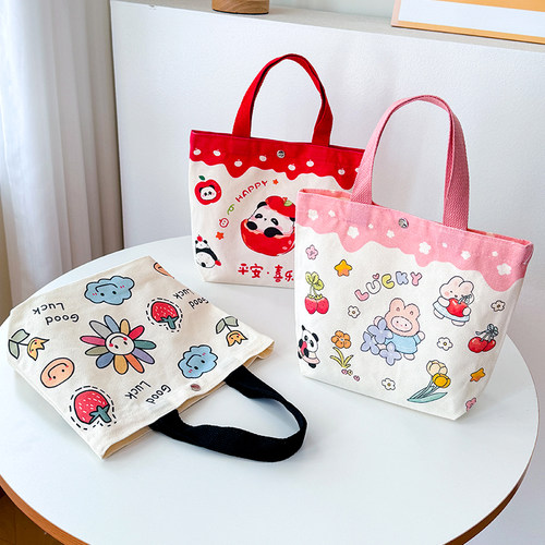 秒杀~大容量帆布包装书本饭盒。