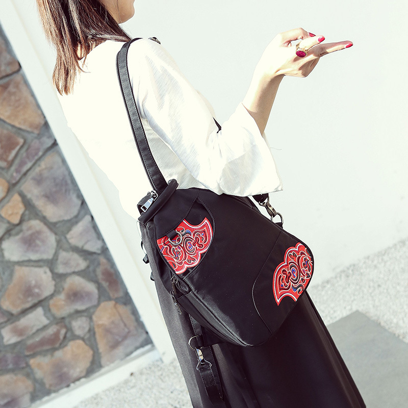 路岩刺绣防水帆布百搭斜跨双肩包