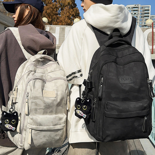 2025新品初中高中生书包女大容量减负双肩包百搭暗纹背包男大学生