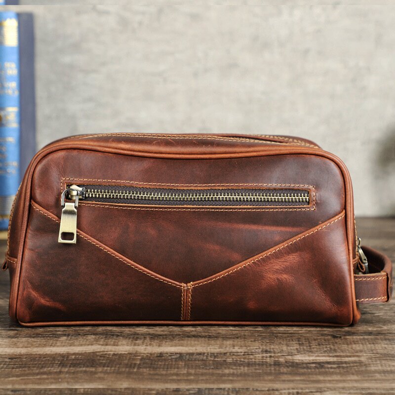 2026新款黑天使工厂货源休闲牛皮手拿包复古疯马皮多功能洗漱包