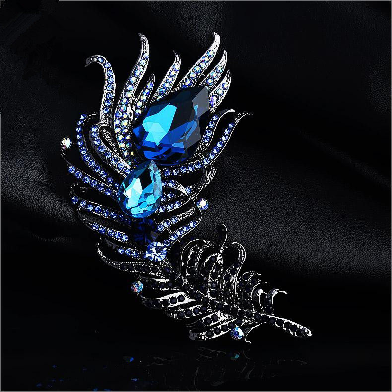 38元包邮 夸张裘皮羊绒大衣专用蓝色玻璃水晶水钻羽毛造型胸针 女