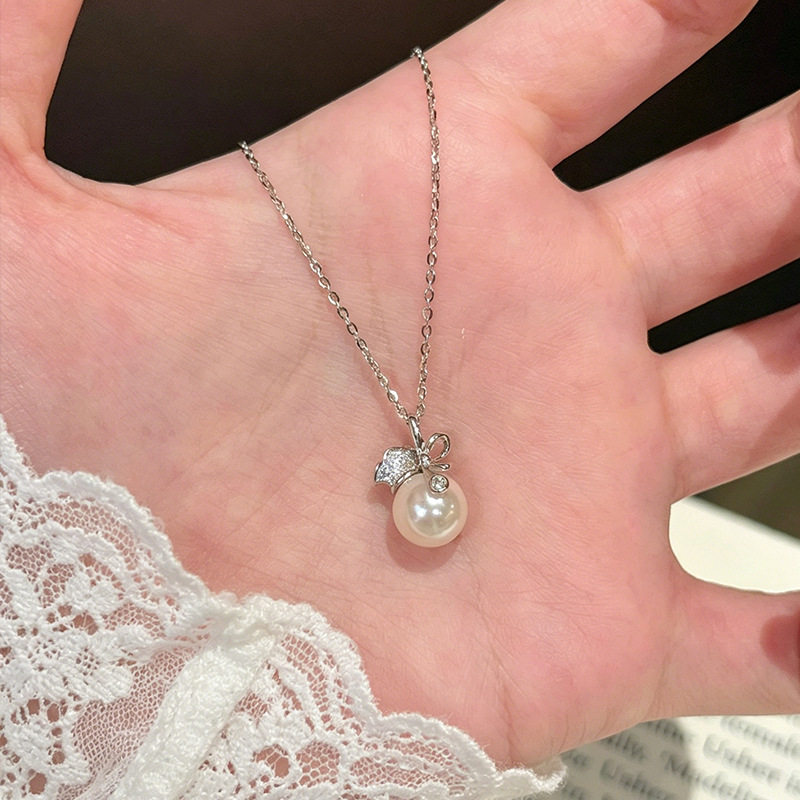 金宏宇珠光福袋项链女925纯银韩版高级感小众设计蝴蝶结贝珠吊坠