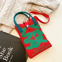 Сумка для мобильного телефона хороша для красного фона